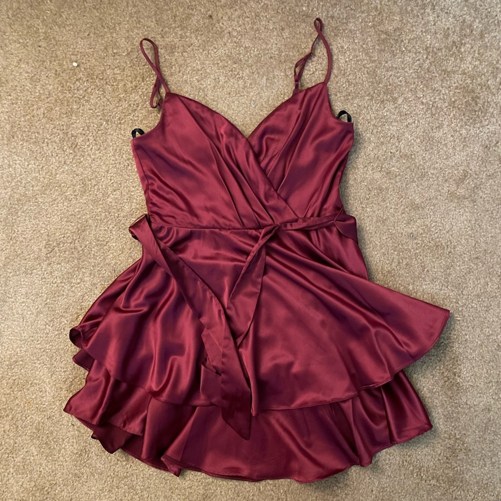 Burgundy satin dress with adjustable straps and tie waist.